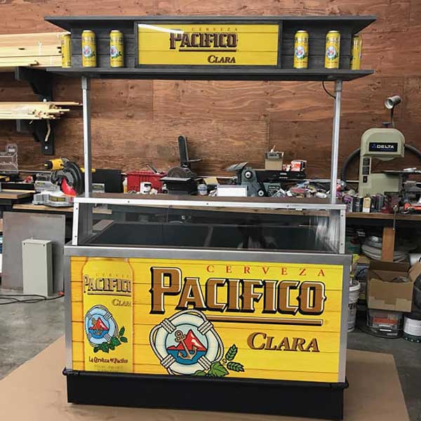 Custom-fabricated Pacifico Cerveza Clara beverage cart with printed graphics